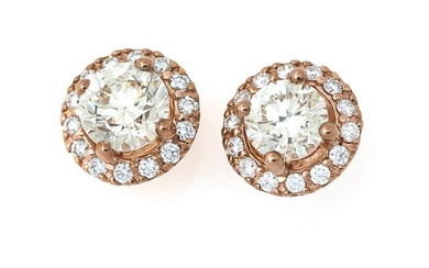 A pair of ear studs each set with numerous brilliant-cut diamonds weighing...