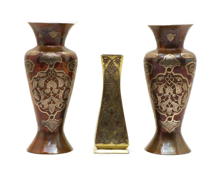 A pair of early 20th century cooper and silver-inlay Damascene vases