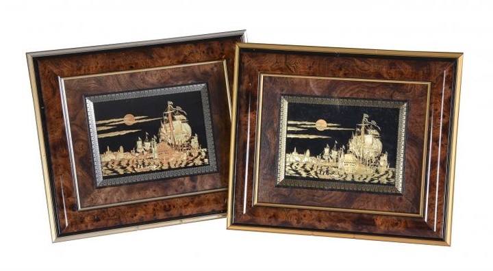 A pair of framed pictures of galleons in a seascape