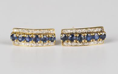 A pair of gold, sapphire and diamond earstuds, each mounted with a row of six circular cut sapphires