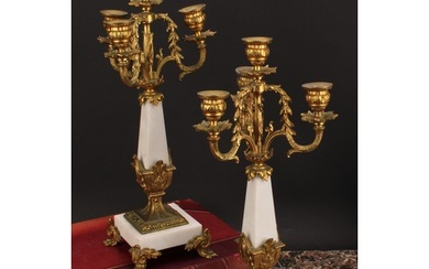 A pair or Louis XVI style gilt metal mounted three branch fo...