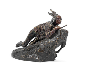 A patinated bronze study of a Native American male with rifle by carl kauba