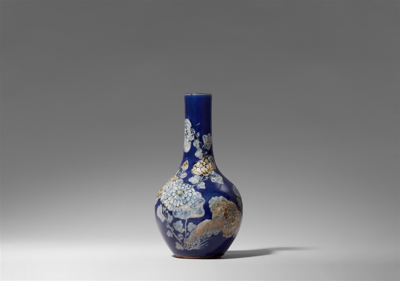 A powder-blue-glazed bottle vase with relief decor. 19th century