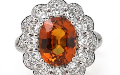 A sapphire ring set with an oval-cut orange sapphire weighing app. 4.72...