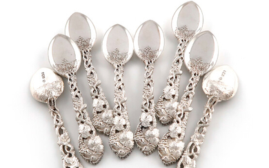 A set of eight Victorian silver pierced Vine pattern ice cream spoons