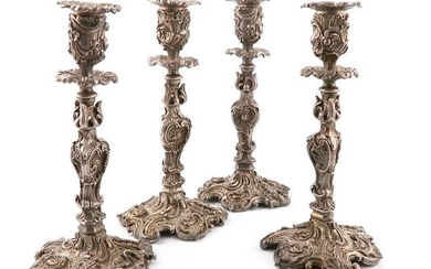 A set of four Victorian electroplated candlesticks, by...
