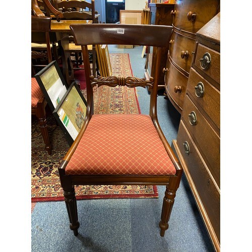 A set of six mahogany bar back dining chairs, each with hori...