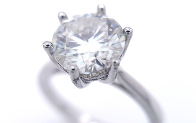 A sterling silver solitaire ring with a stunning round...