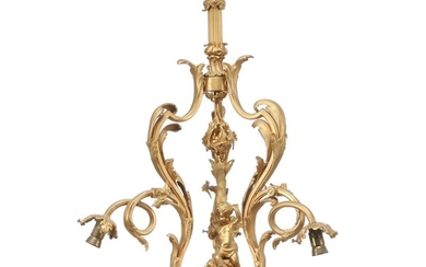 A three-light Rococo style gilt-bronze chandelier. Electrical. Early 20th century. H. 70 cm. Diam. 55 cm.