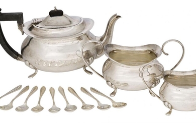 A three-piece silver tea set, Birmingham, c.1922, F. H. Adams...
