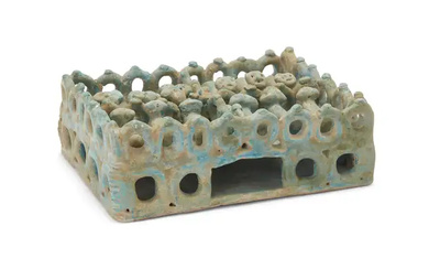A turquoise glazed moulded pottery model of an animal pen, Kashan, Eastern...