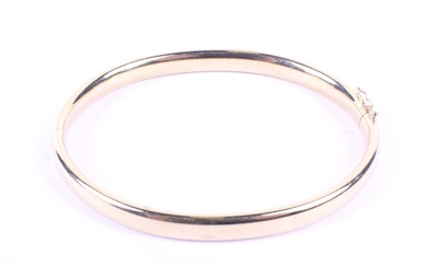 A vintage Italian 18ct gold hollow D-section hinged bangle. Import hallmarks for Edinburgh 1998, 14.