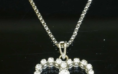 A white gold diamond set heart pendant