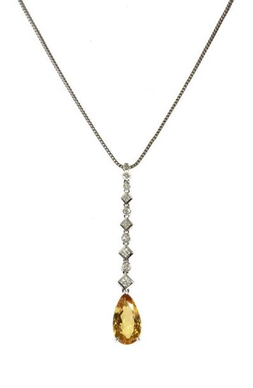 A white gold yellow topaz and diamond pendant, a pear...