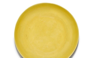 A yellow-glazed 'lotus' dish, Mark and period of Yongzheng | 清雍正 黃釉刻蓮紋盤 《大清雍正年製》款
