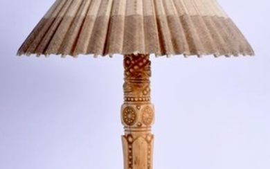 AN EARLY 20TH CENTURY EASTERN CARVED IVORY PARASOL
