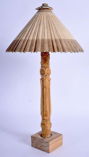 AN EARLY 20TH CENTURY EASTERN CARVED IVORY PARASOL