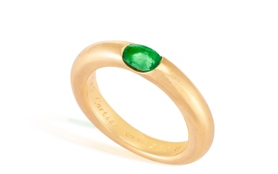 AN EMERALD 'ELLIPSE' RING, BY CARTIER, 1992 The oval-shaped...