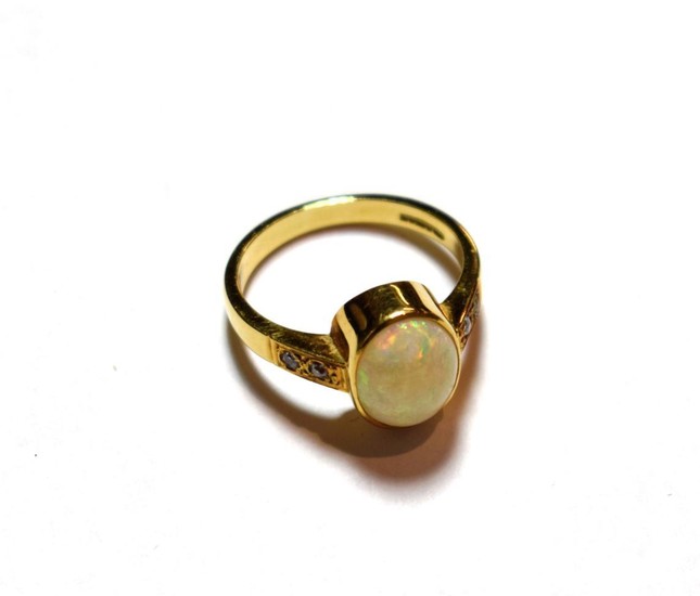 An 18 carat gold opal ring, finger size Q