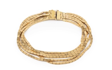 An 18ct gold five strand bracelet, composed of flexible flattened...