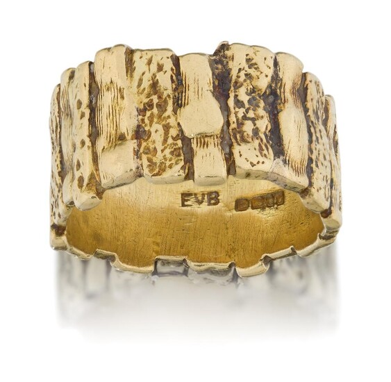 An 18ct gold ring, of textured design, composed of a series of textured panels, approx. British hallmarks, 12mm wide, approx. ring size V½, gross weight approx. 16g