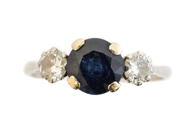 An 18ct gold sapphire and diamond three stone ring