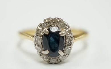 An 18ct, sapphire and diamond set oval cluster ring, size L,...