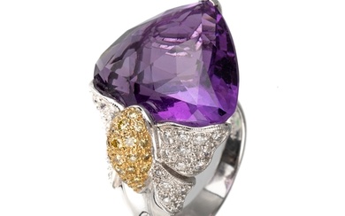 An 18ct white gold diamond and amethyst dress ring, set with...