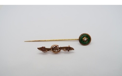 An 18ct yellow gold (tested) tie pin with jade and pearl tog...