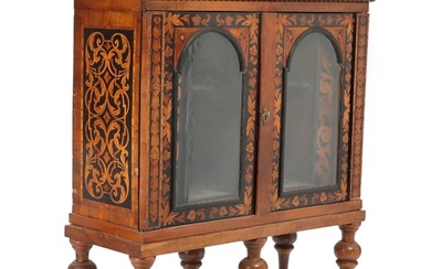 An 18th-19th century Dutch Baroque walnut display cabinet, inlaid with flowers and foliage. H. 186. W. 147. D. 60 cm.