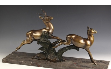 An Art Deco bronze animal group modelled as a leaping stag a...