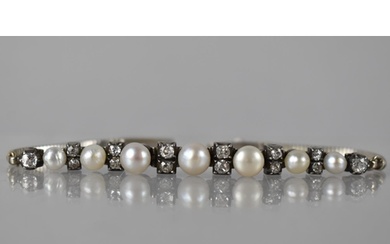 An Early 20th Century Diamond and Pearl Line Bracelet in 9ct...