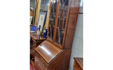 An Edwardian Mahogany and Inlaid Bureau Bookcase with urn in...