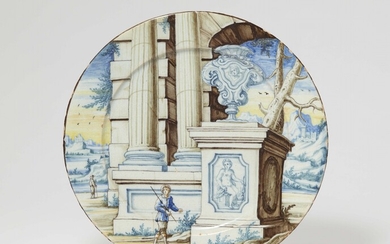 An Italian majolica dish with ruins in a landscape