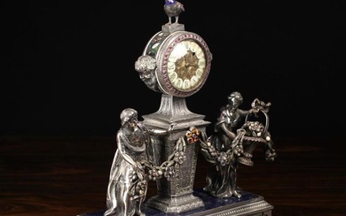 An Ornate 19th Century Silver Figural Clock with intricately engraved decoration enriched with champ