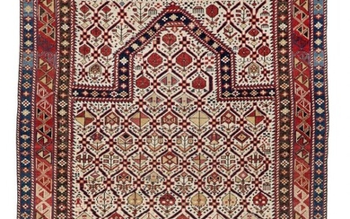 An antique Daghestan prayer rug, Caucasus. Flower-filled trellis pattern with mirab on...