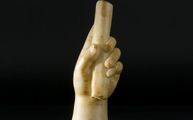 An antique marble sculpture of a left hand