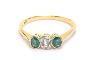 An early 20th century 18ct gold and platinum bezel set emera...