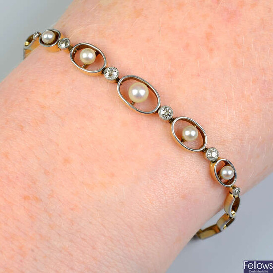 An early 20th century platinum and 18ct gold graduated seed pearl and diamond bracelet.
