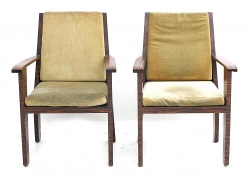 Two rosewood veneered armchairs with yellow upholstered cushions, circa 1930, some water stains.