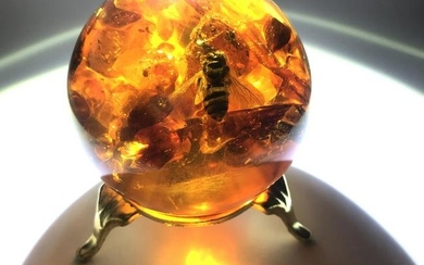 Beautiful Vintage Amber Ball with inclusions on a
