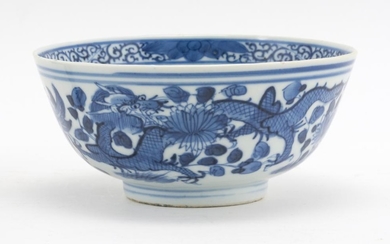 CHINESE BLUE AND WHITE PORCELAIN BOWL With a four-clawed dragon design. Four-character Kangxi mark on base. Height 2.75". Diameter 5...