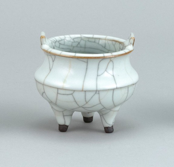 CHINESE GUAN WARE PORCELAIN CENSER Ovoid, with rectangular handles and tripod base. Diameter 3.5".