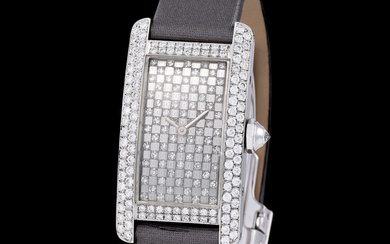 Cartier. Fine and Elegant Tank Americaine Rectangular-shape Wristwatch in White Gold And...