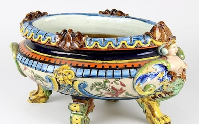 Ceramic jardinière of the Wilhelminian period, Johann Glatz, Villingen c. 1890, ceramic light-coloured shards, oval bowl with fully plastic feet, two of which are paw-shaped, female winged fantasy creatures at both ends, 2 mascarons in the middle...