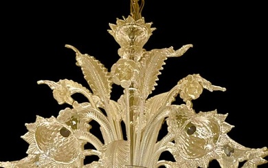 Chandelier - six lights in artistic glass, tall flower and leaf elements.