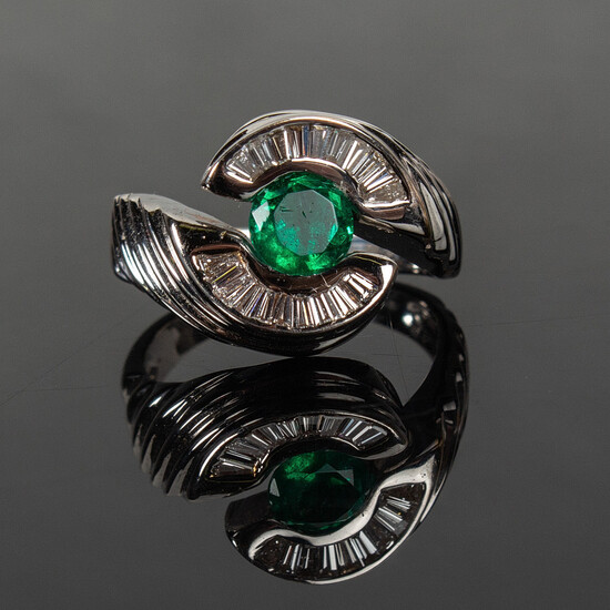 Emerald ring with diamonds.
