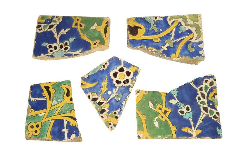 FIVE FRAGMENTARY SAFAVID CUERDA SECA POTTERY TILES: THE GARDEN Iran, 17th century