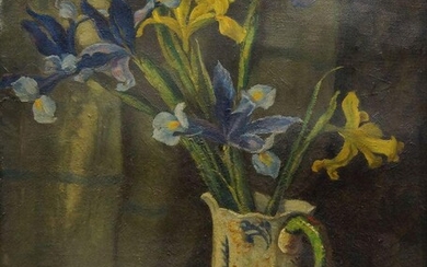 Faith Kenworthy-Browne, British 1882-1973- Daffodils and Irises in a blue and white jug; oil on canvas, signed with initials and dated '1945' (lower left), bears label from the Society of Women Artists to the reverse of the frame, 53.5 x 42 cm:...