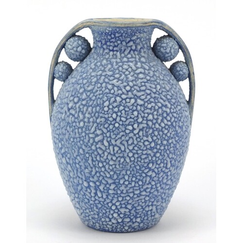 French Art Deco twin handled pottery vase having a blue glaz...